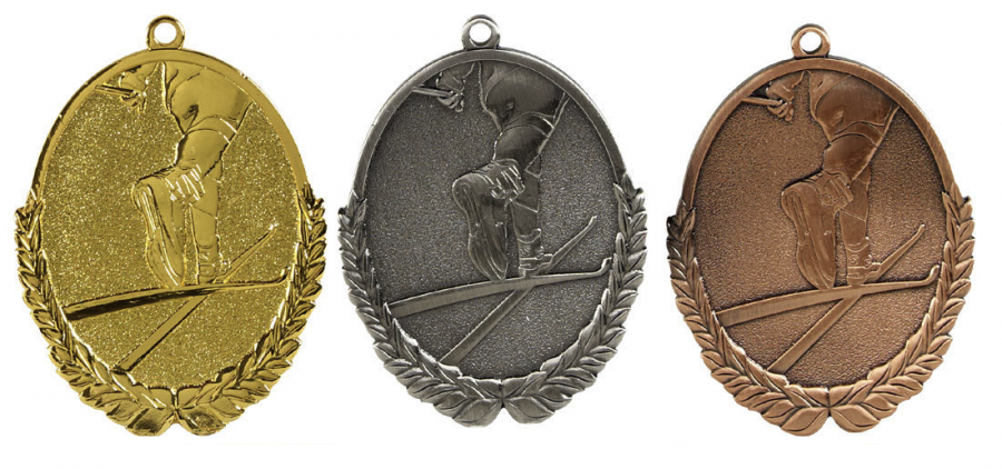 Skidning Tre medaljer på rad guld silver brons