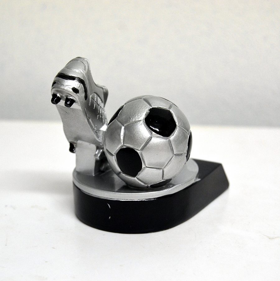silver football shoe and a football