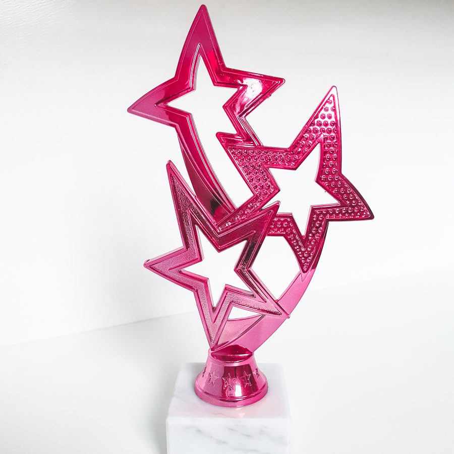 Pink award with three stars